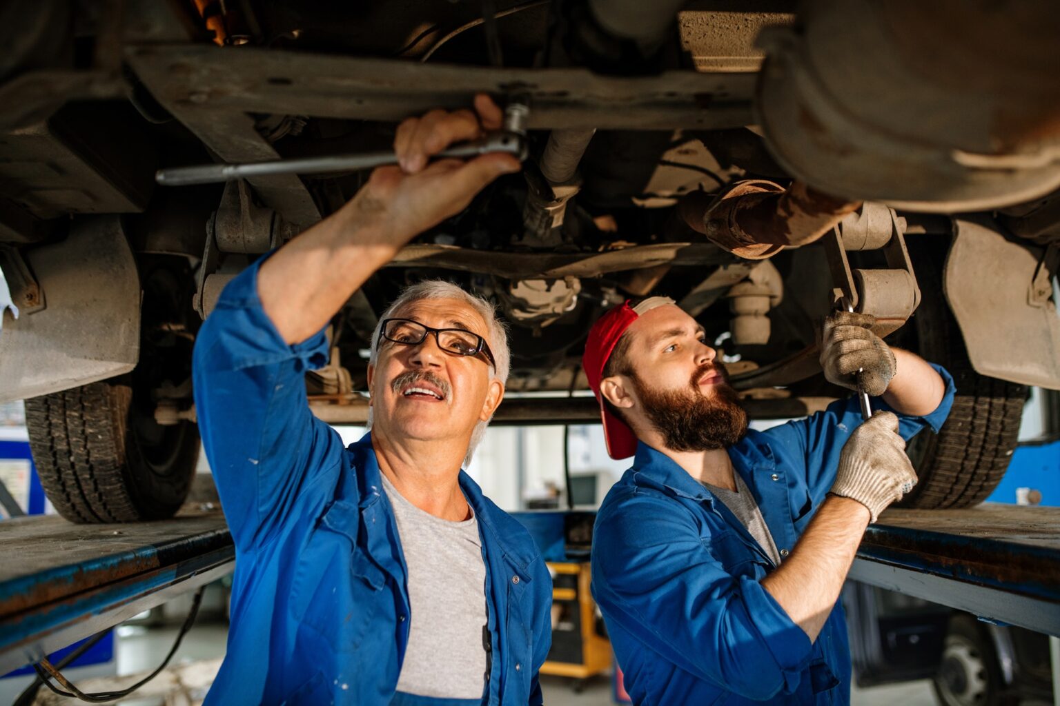 El Rancho P Auto technicians repairing a car motor